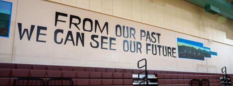 From Our Past We Can See Our Future written in large letters on school wall